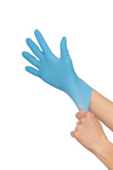 doctor putting on blue sterilized medical glove for making operation