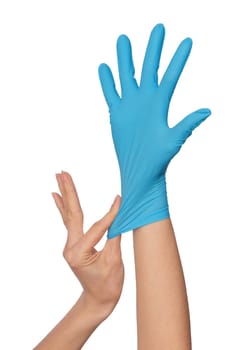 doctor putting on blue sterilized medical glove for making operation