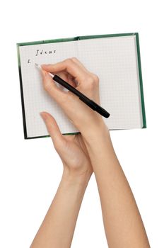 business woman writes ideas for business plan