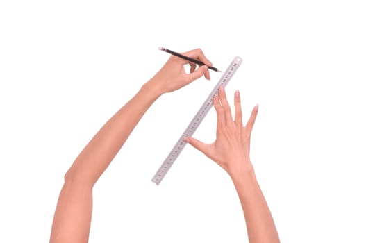 woman draws line with rule and pencil on white background