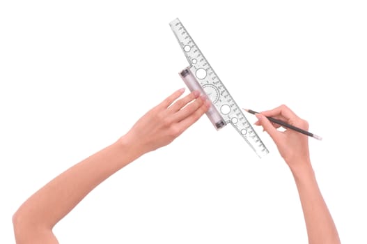 woman draws line with rule and pencil on white background