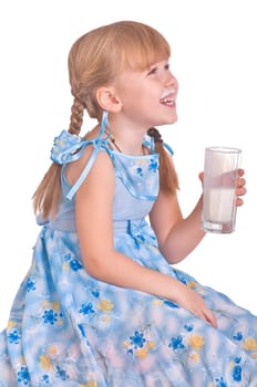laughing girl drinking a glass of milk on white background