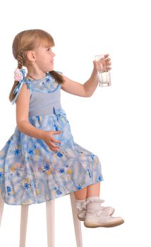 laughing girl drinking a glass of water on white background