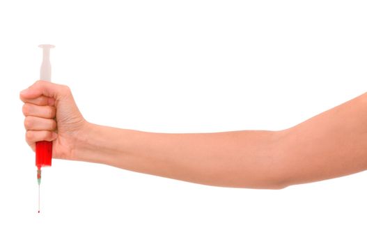 syringe in the woman's hand for making injections on white background