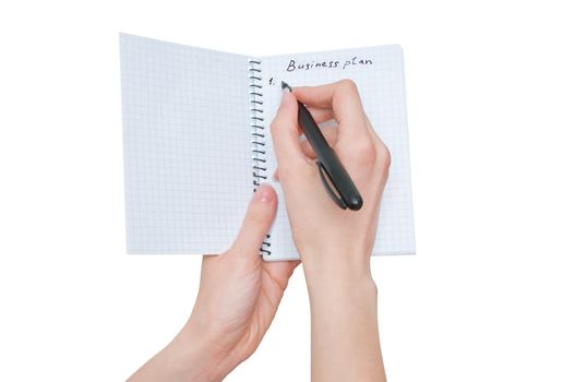 business woman writes business plan on white background