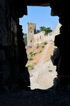 genovese stronghold through the old window on dark background