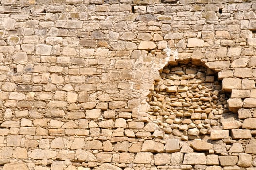 Big hole in the old wall of defensive fort