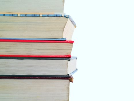 Old Textbooks stacked on a blank background