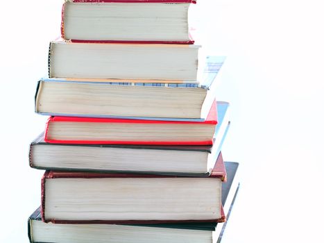 Old Textbooks stacked on a blank background