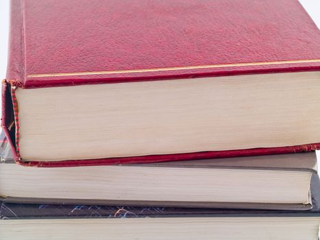 Old Textbooks stacked on a blank background