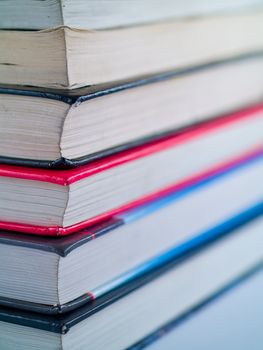 Stack of old textbooks viewed from the corner