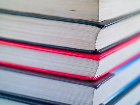 Stack of old textbooks viewed from the corner