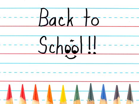 Back to School Written on a Lined Dry Erase Board with Colored Pencils