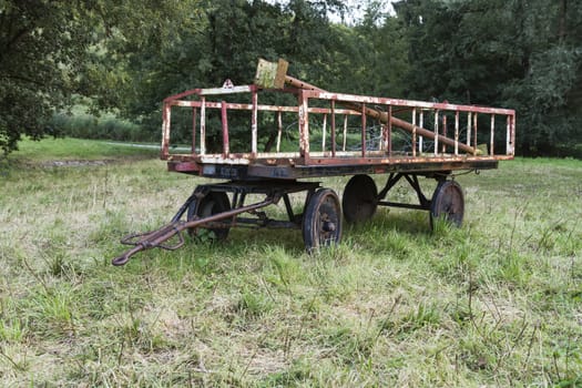 old rusty trailer on meadow. unused for a long time