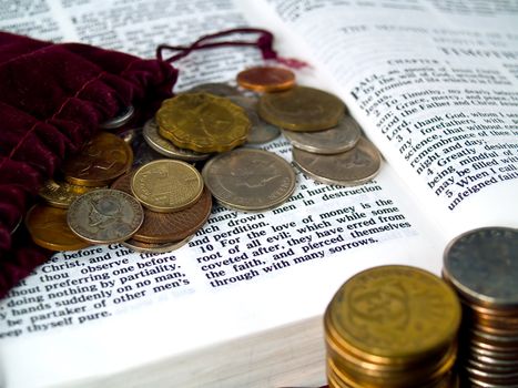 The Bible opened to I Timothy 6: 10 Love of Money