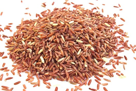 PILE OF BROWN RICE ISOLATED ON WHITE