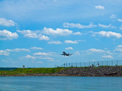 A Commercial Airliner Taking Off into a Partly Cloudy Blue Sky