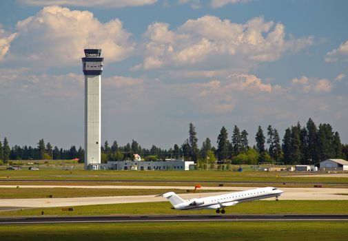 Air Traffic Control Tower and an Airplane Taking Off