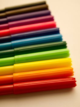 Colorful pens on white background