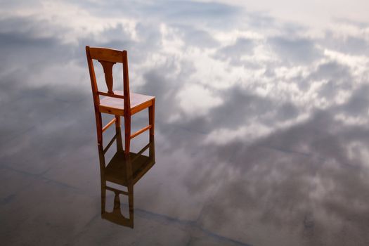 The restless chair in the pond at sunset