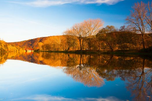Autumn reflection on the Berounka river in Czech Republic
