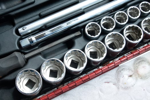 Socket wrench set in toolbox.