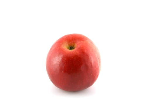 One ripe red apple over white