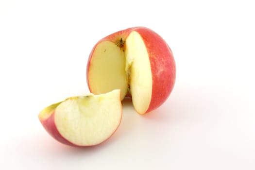 Prepared ripe red apple with slice. Shallow DOF.