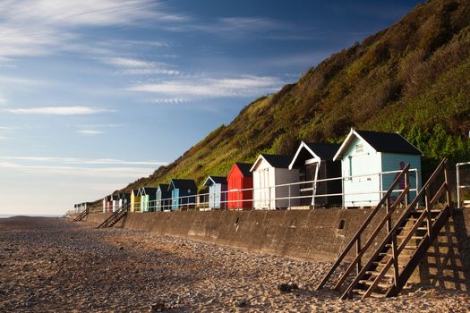 Colourful beach huts with blue sky