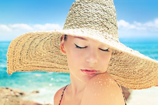 Beautiful woman on a beach on a sunny day 