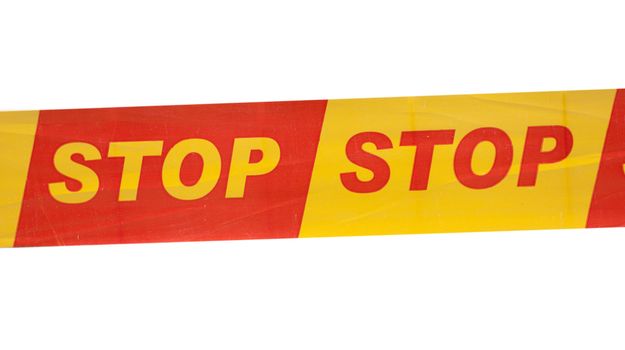 Strip with written STOP sign against white background