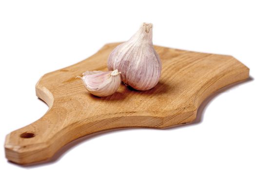 Garlic on cutting plate isolated