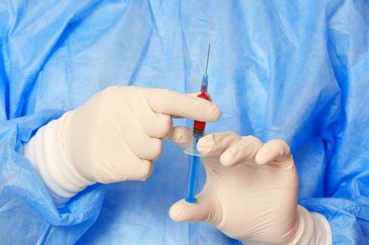 doctor holding a syringe with new synthetic drug mixed with blood