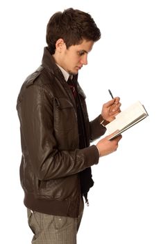 businessman writing a daily plan of action in his notebook