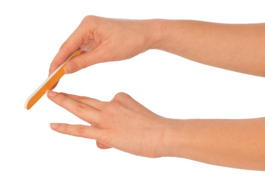 woman files her nails by emery board from manicure set