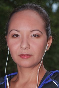 Portrait of a Mongolian woman with sporty headphones