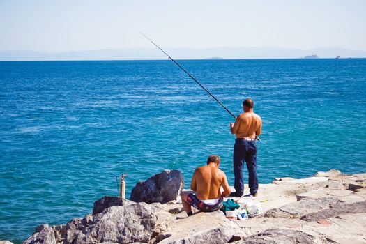 two men fishing in bosphorus, istanbul, Turkey