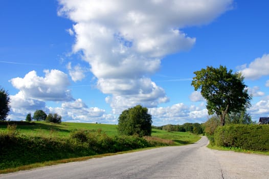 Landscape with road and the cloudy sky