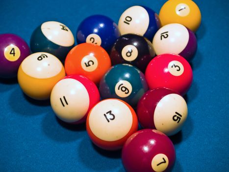 Billiards balls on a green pool table