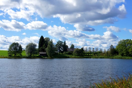 Lake and trees on a background of the sky