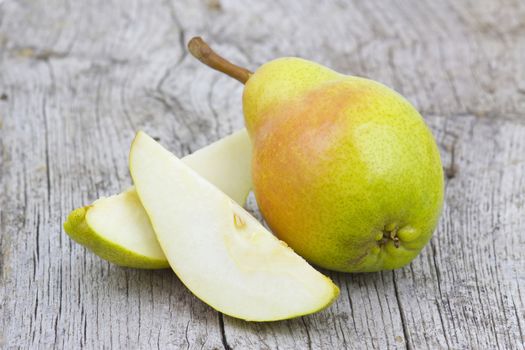 Fresh pear on old wooden background