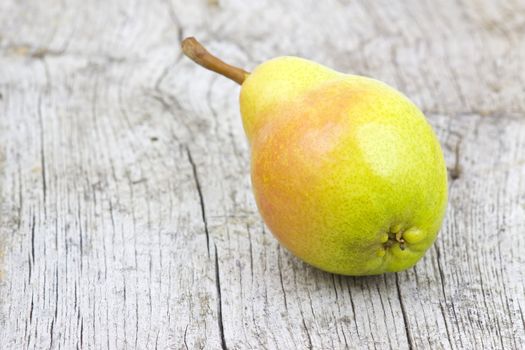 Fresh pear on old wooden background 