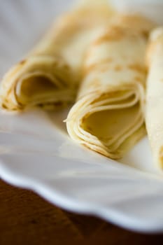 Tasty pancakes on a white plate