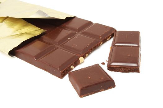 Chocolate bars in gold cover isolated on white background