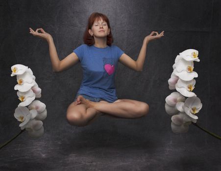woman meditates in the air smelling flowers