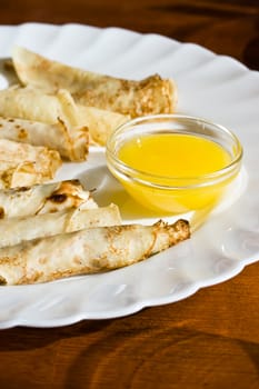 Pancakes on a plate with honey