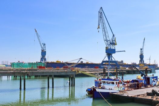Industrial landscape. Cranes in shipyard 