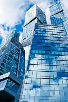 Modern skyscrapers and reflections of the clouds