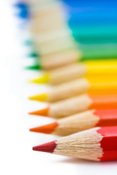 coloured pencils with shadow on white background
