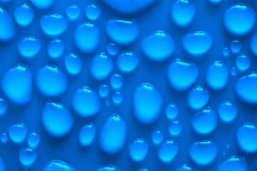 Water drops on a blue surface